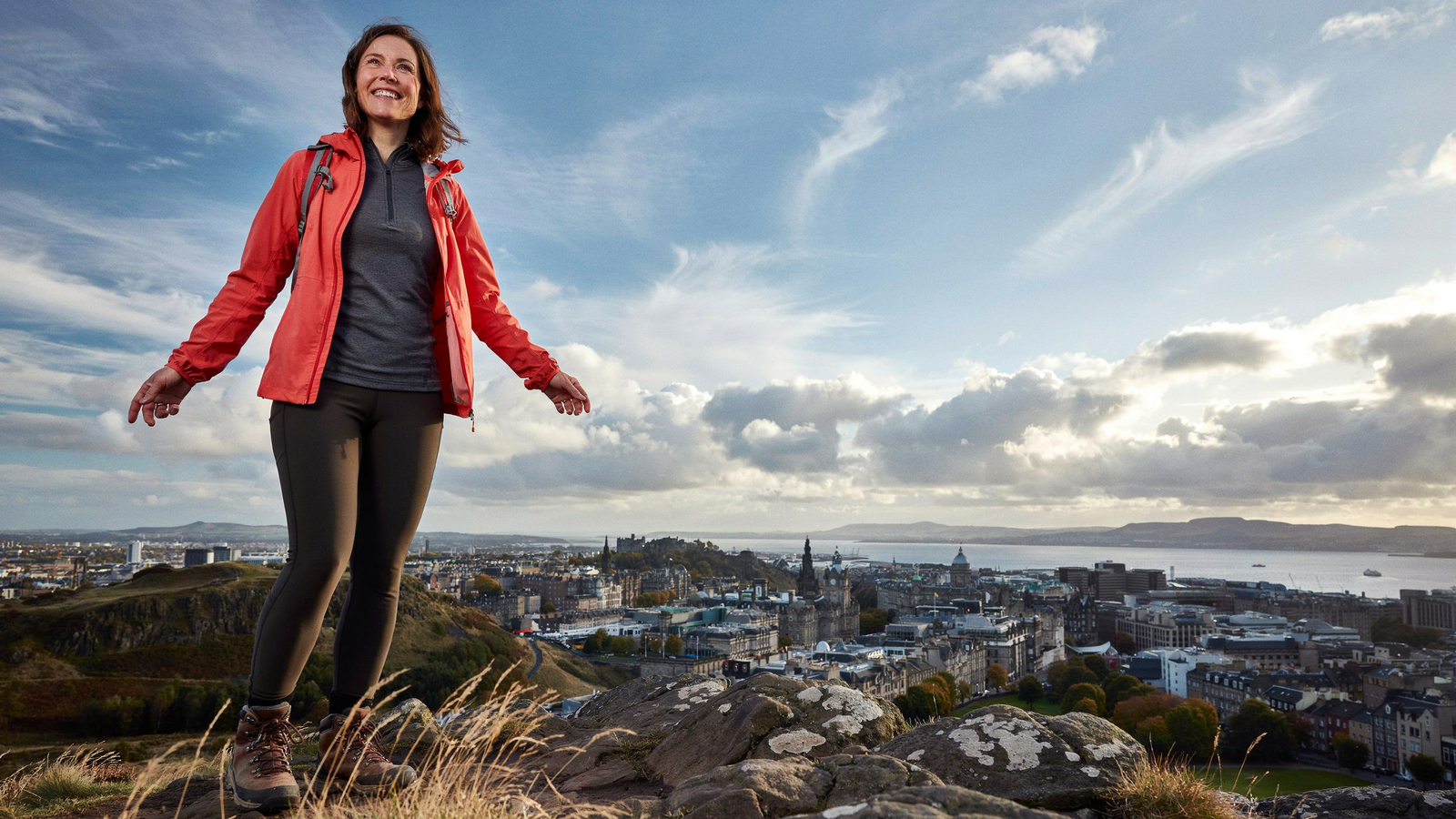 Woman walking through Holyrood Park in Edinburgh with Arthur's Seat in the background — Mounjaro consultation at Edinburgh Vaccination Clinic