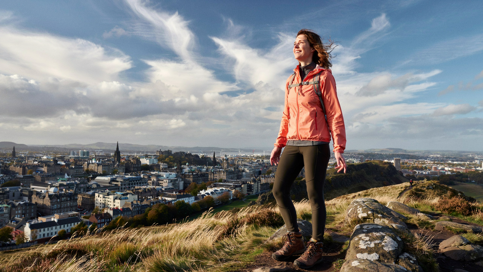 Woman at the summit of Arthur's Seat in Edinburgh — Mounjaro dose guide results at Edinburgh Vaccination Clinic