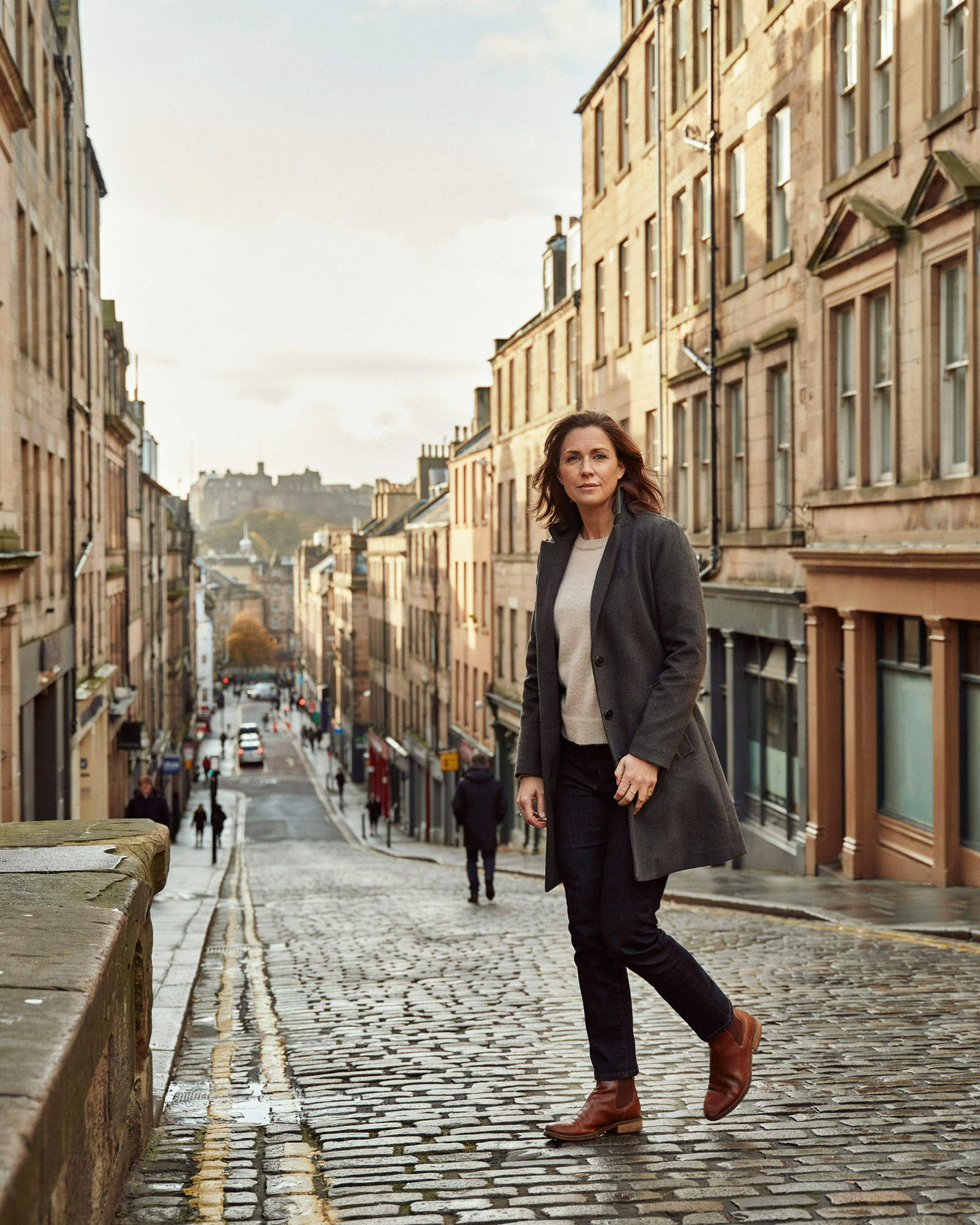 Woman walking with confidence along Bruntsfield Place in Edinburgh after booking a Mounjaro eligibility assessment at Edinburgh Vaccination Clinic