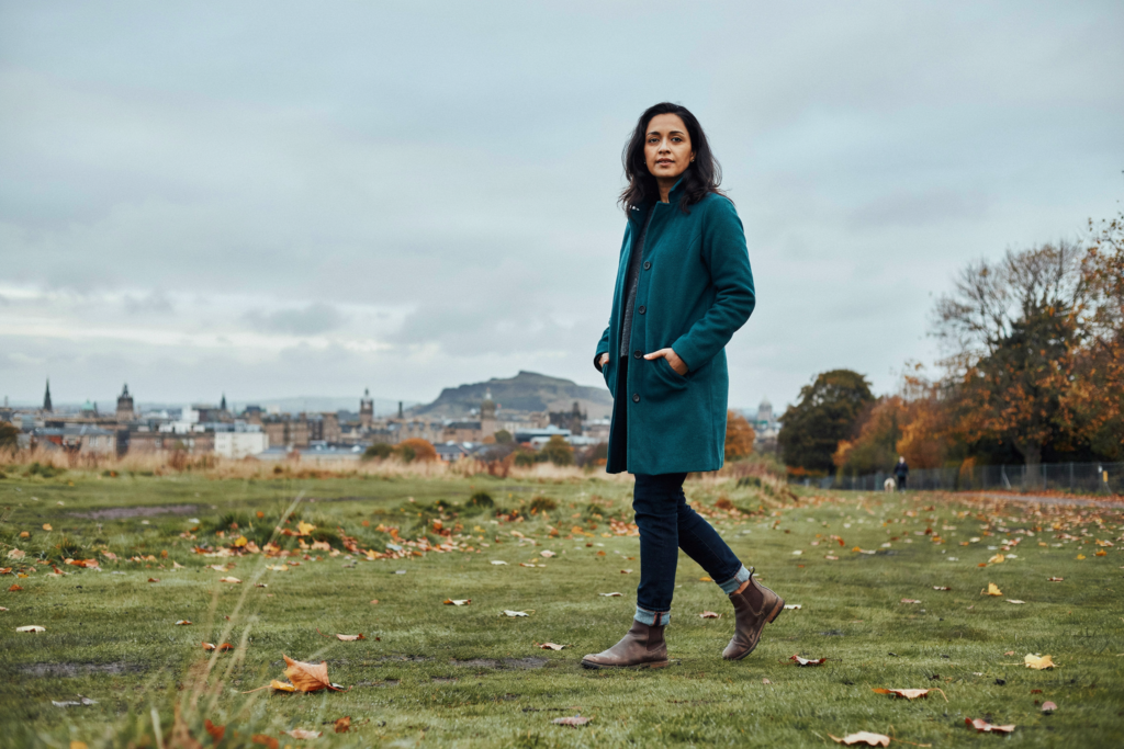 Person walking across Bruntsfield Links in Edinburgh on an autumn morning
