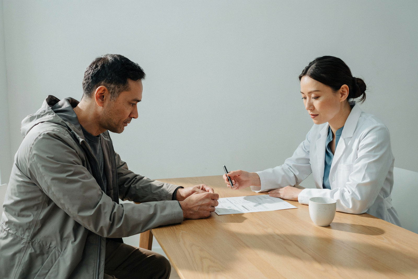 Pharmacist and patient discussing weight management treatment at an Edinburgh clinic