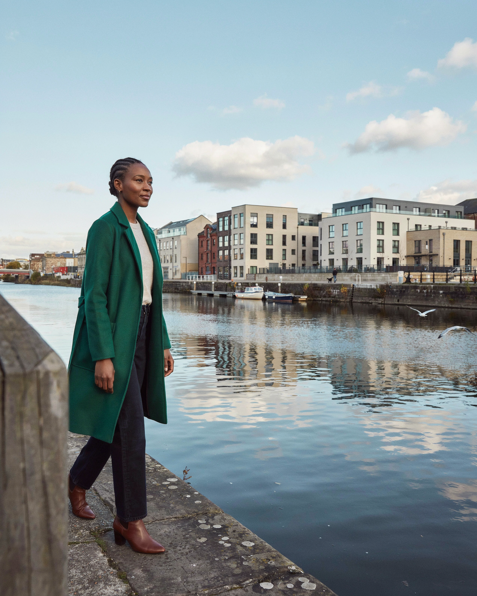 Person walking along the Leith waterfront in Edinburgh