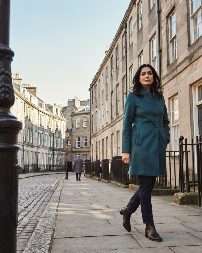 Person walking through Edinburgh New Town on a bright morning